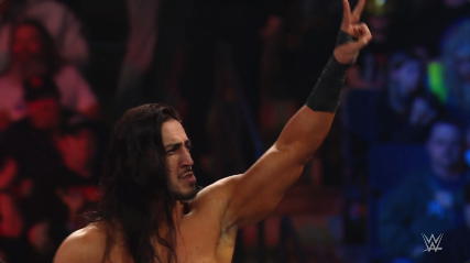 A victorious Mustafa Ali acknowledges the WWE Universe.  (Photo Credit: WWE)