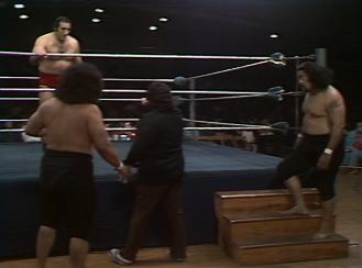 The Wild Samoans (Afa & Sika) and their manager, Captain Lou Albano, stare at Dominic DeNucci.  (Photo Credit: WWE Network/Peacock)