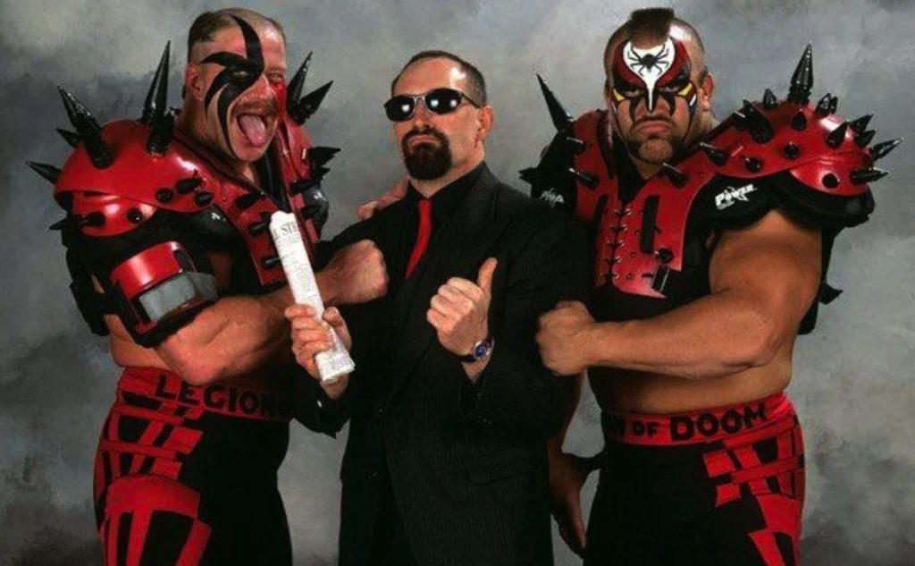 At WWF WrestleMania VIII, The Legion of Doom were reunited with their former manager, Paul Ellering.  (Photo Credit: WWF)