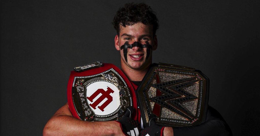 Declan McMahon poses with the IU Takeaway Belt and the WWE Universal Championship. (Photo Credit: Declan McMahon)