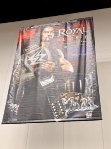 The poster for "WWE Royal Rumble 2016" hung above the superstore.