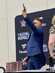 The Miz arrives at the WWE/Fanatics auction table.